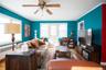 Living area featuring ornamental molding, radiator heating unit, a ceiling fan, and wood finished floors
