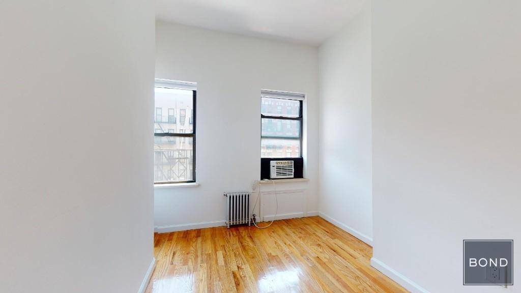 Renovated 2 bedroom with hardwood floors, high ceilings and a marble bath.
