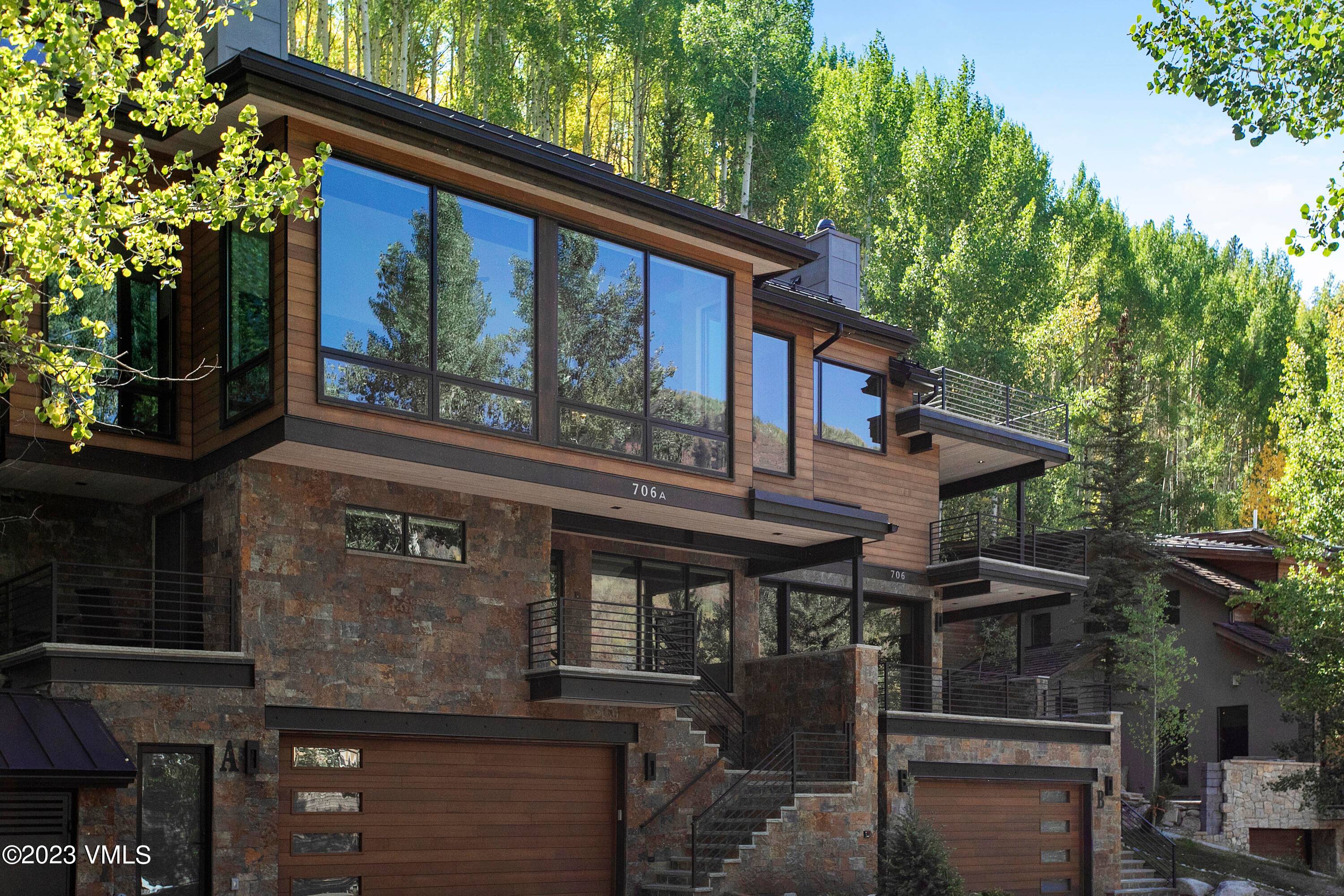 Rare opportunity to own a new construction, Mountain Modern Contemporary home on the coveted Forest Road.