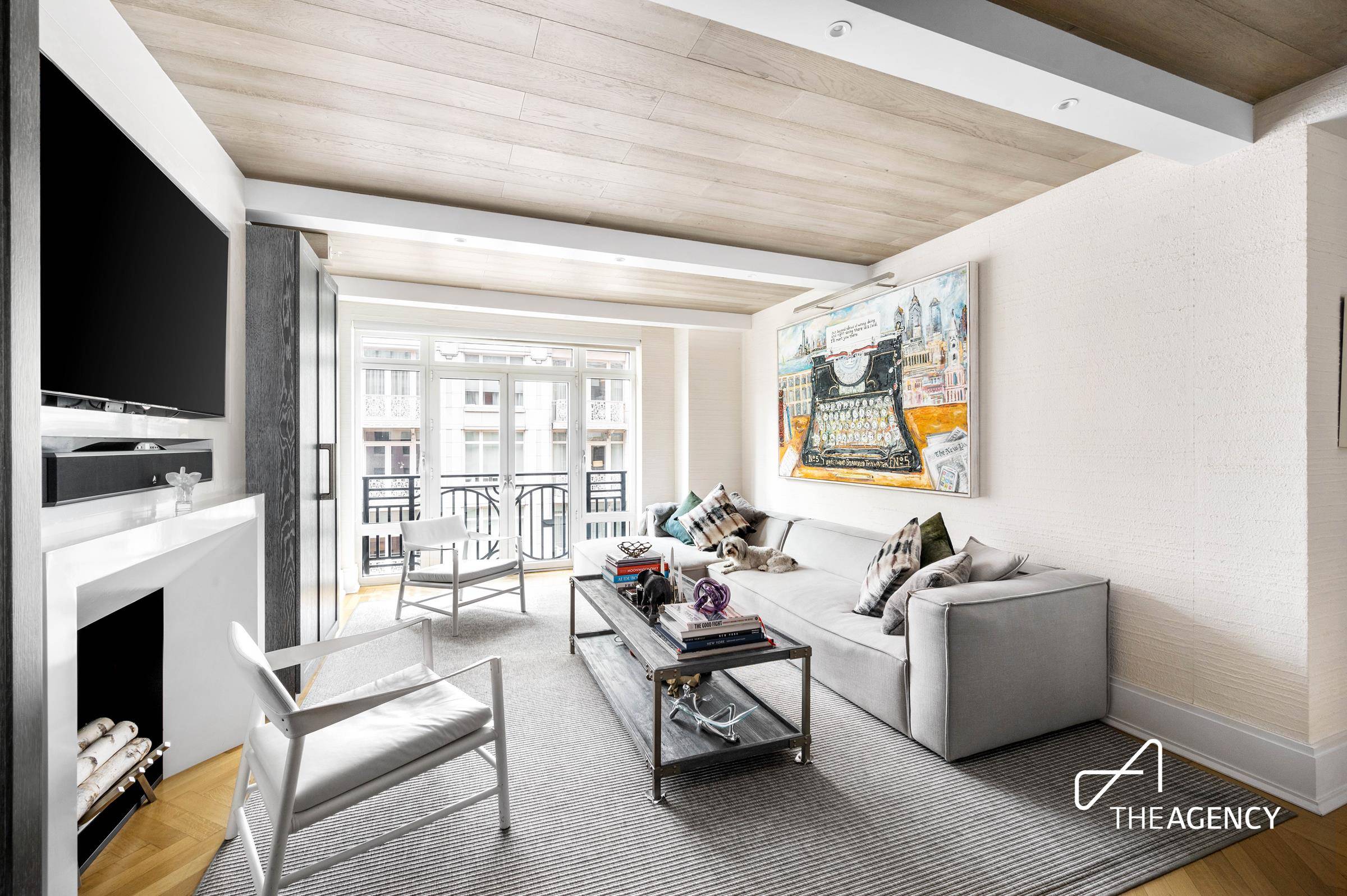 Welcome to this designer renovated 2 bedroom, 2 bathroom home at The Harrison, a premier full service condominium designed by world renowned Robert A.