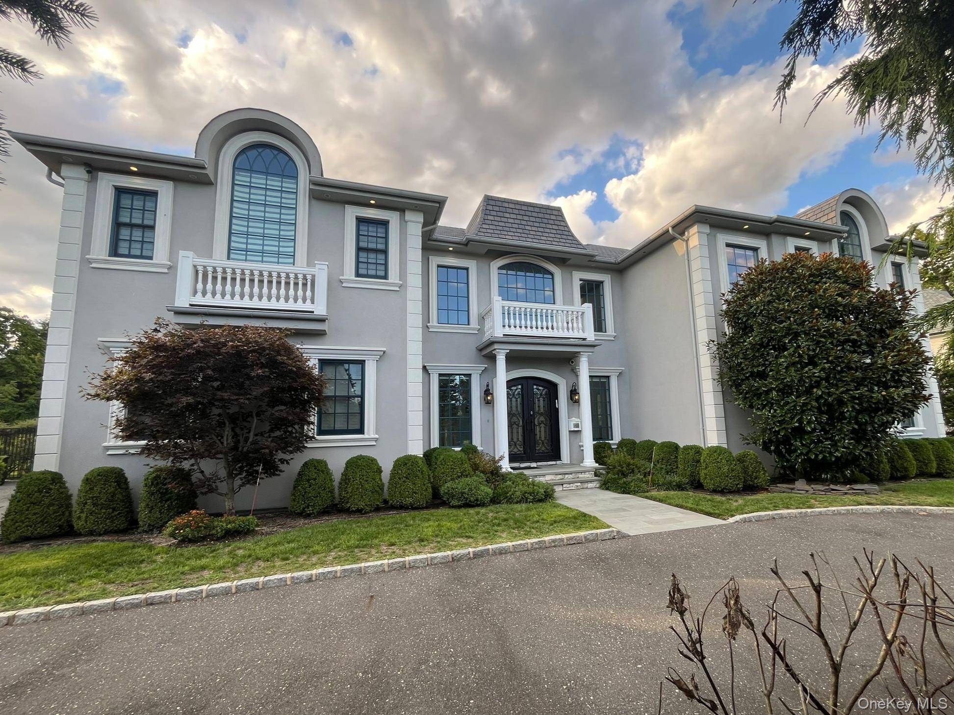 Elegant custom colonial on nearly ¾ acre with pool and outdoor kitchen.