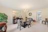 Formal dining room. The door in the back leads into the kitchen.