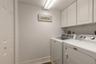 In unit laundry room with storage