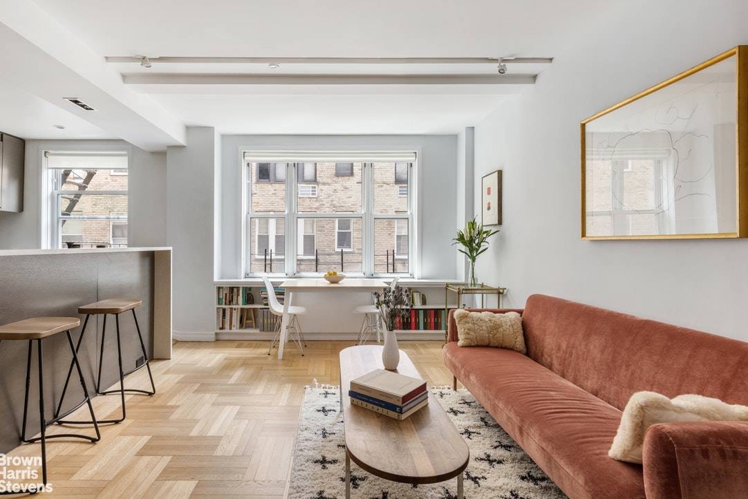 Beautifully gut renovated two bedroom, one and a half bath apartment with wall of 9 South facing windows and 1 West facing window at 60 Gramercy Park North.