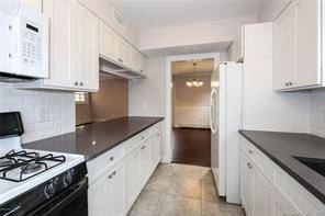 Downtown Greenwich Luxury two bedroom plus loft accessed through and overlooks primary bedroom townhome recently renovated.