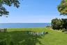 View of grassy yard featuring a water view