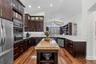 Galley-style kitchen layout with custom cabinetry and open flow.
