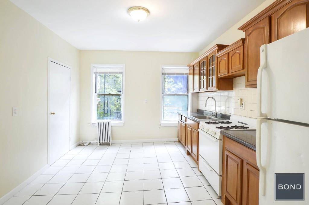 Entire 2nd floor of a 4 story building featuring a tremendous,, eat in kitchen, large living room, hardwood floors, two generous bedrooms a nicely tiled bathroom.