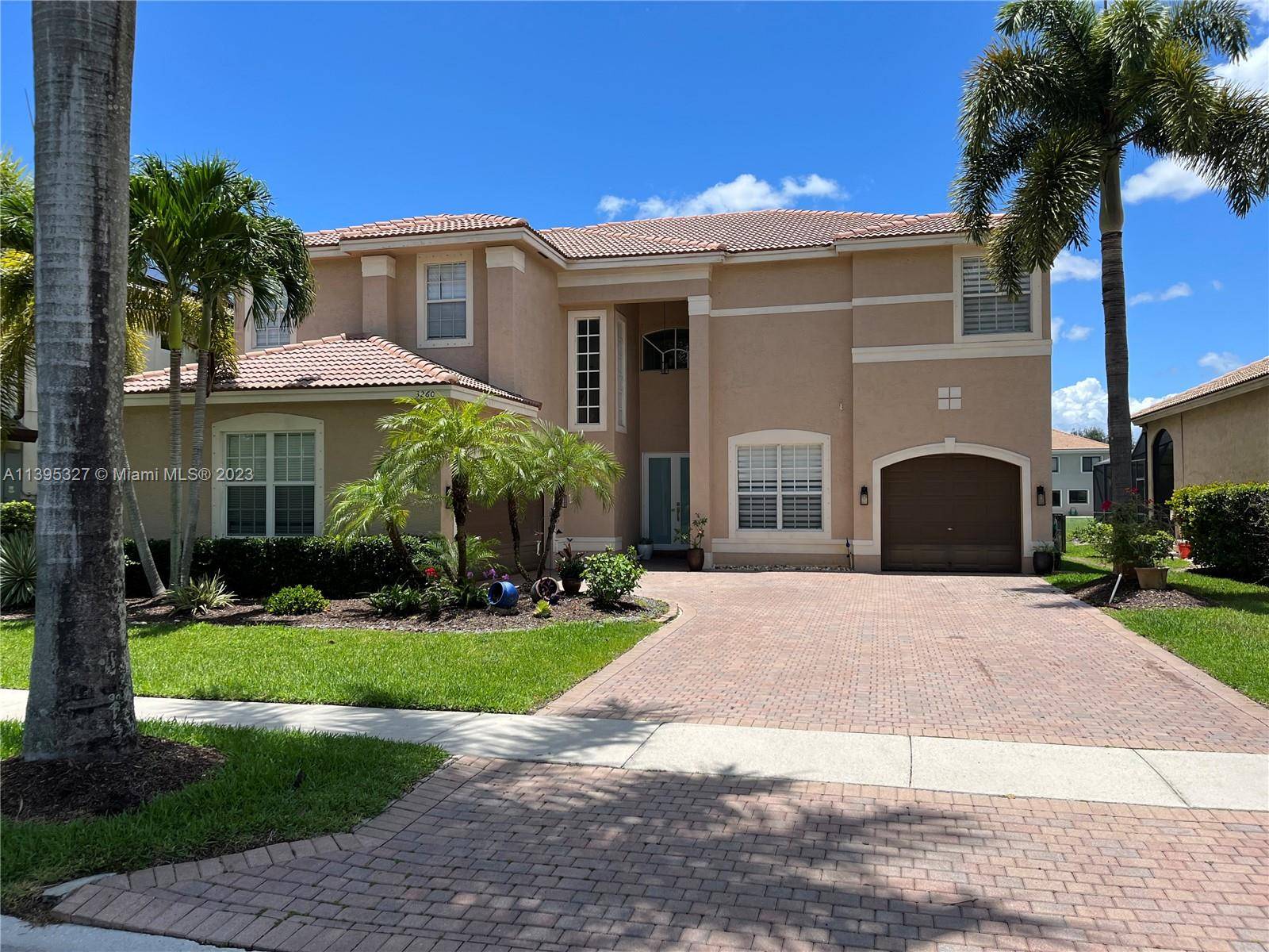 Spectacular waterfront home in exclusive gated community of Sunset Lakes, Vizcaya subdivision.