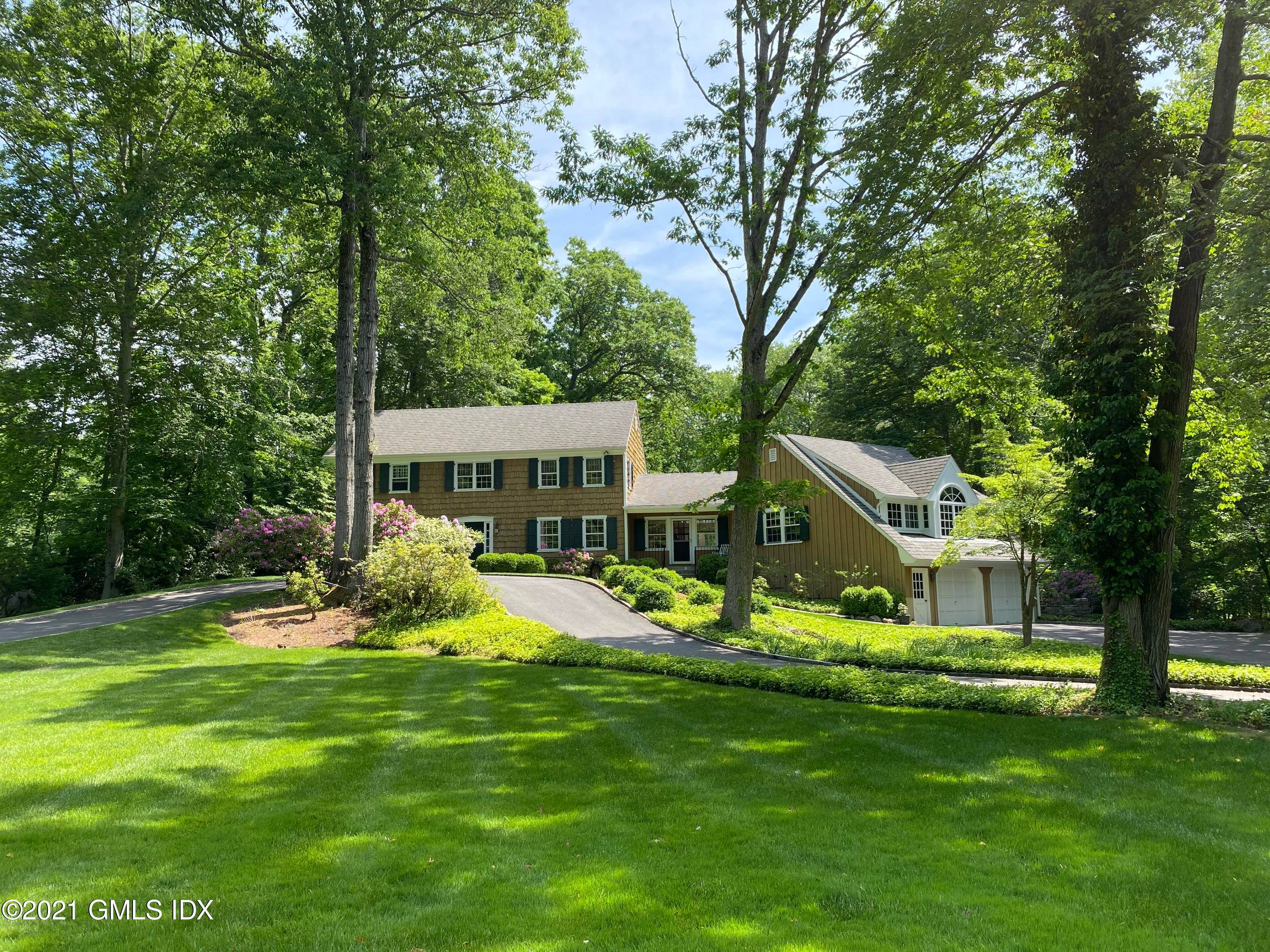 MOTIVATED SELLER ! 5 bedroom colonial located in prime mid country with sprawling front green level lawn and flat level yard.