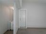 Flex space (400 sqft) with high ceilings, private exterior entrance/exit, and sink/plumbing.