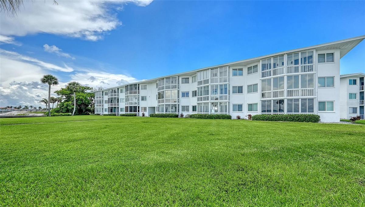 This is a view of the condo from the back lawn. Unit 24 is the second floor, third balcony from the left, with hurricane impact windows.