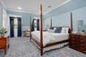 Bedroom featuring carpet flooring, crown molding, and recessed lighting