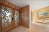 Really pretty front door, for both form and function bringing in that natural sunrise glow in an artistic way!
