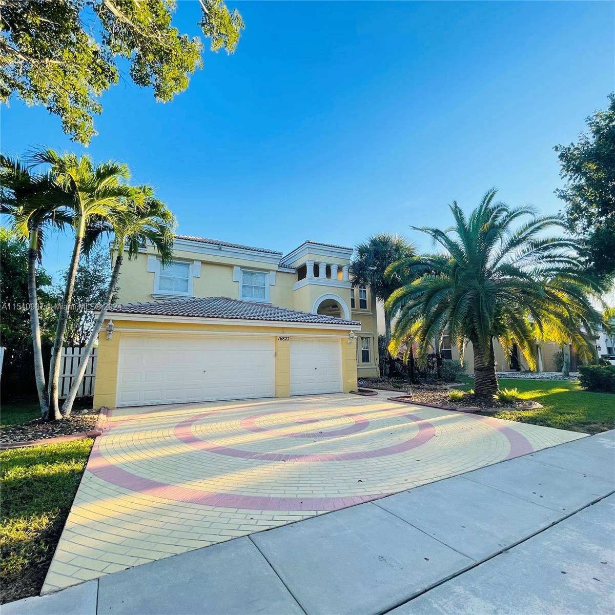 Beautiful 5 3. 5 Bedroom Den, 3 car garage, pool lake view home located in cul de sac of the exclusive community of Riviera Isles.