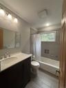 First Floor Bathroom.Newly tiled with a bathtub