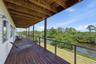 Covered balcony/deck 2nd level- Primary and 3rd bedroom Access