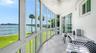 The enclosed lanai offers hurricane impact windows that slide open so you can enjoy the sea breeze