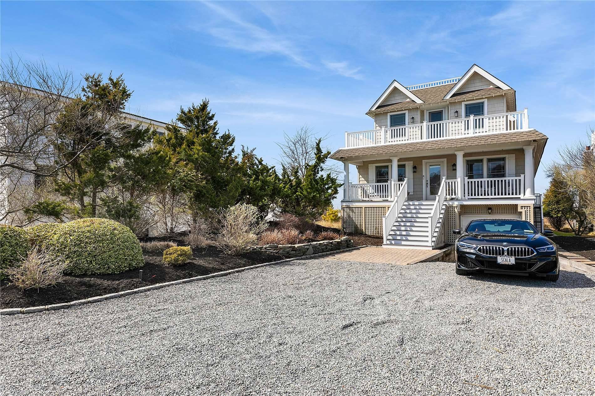 Dune Road Open Bayfront with Beautiful Sunset Views, Roof top Deck with Ocean amp ; Bay Views, Gunite Heated Salt Water Pool and Hot Tub surrounded by a Huge No ...