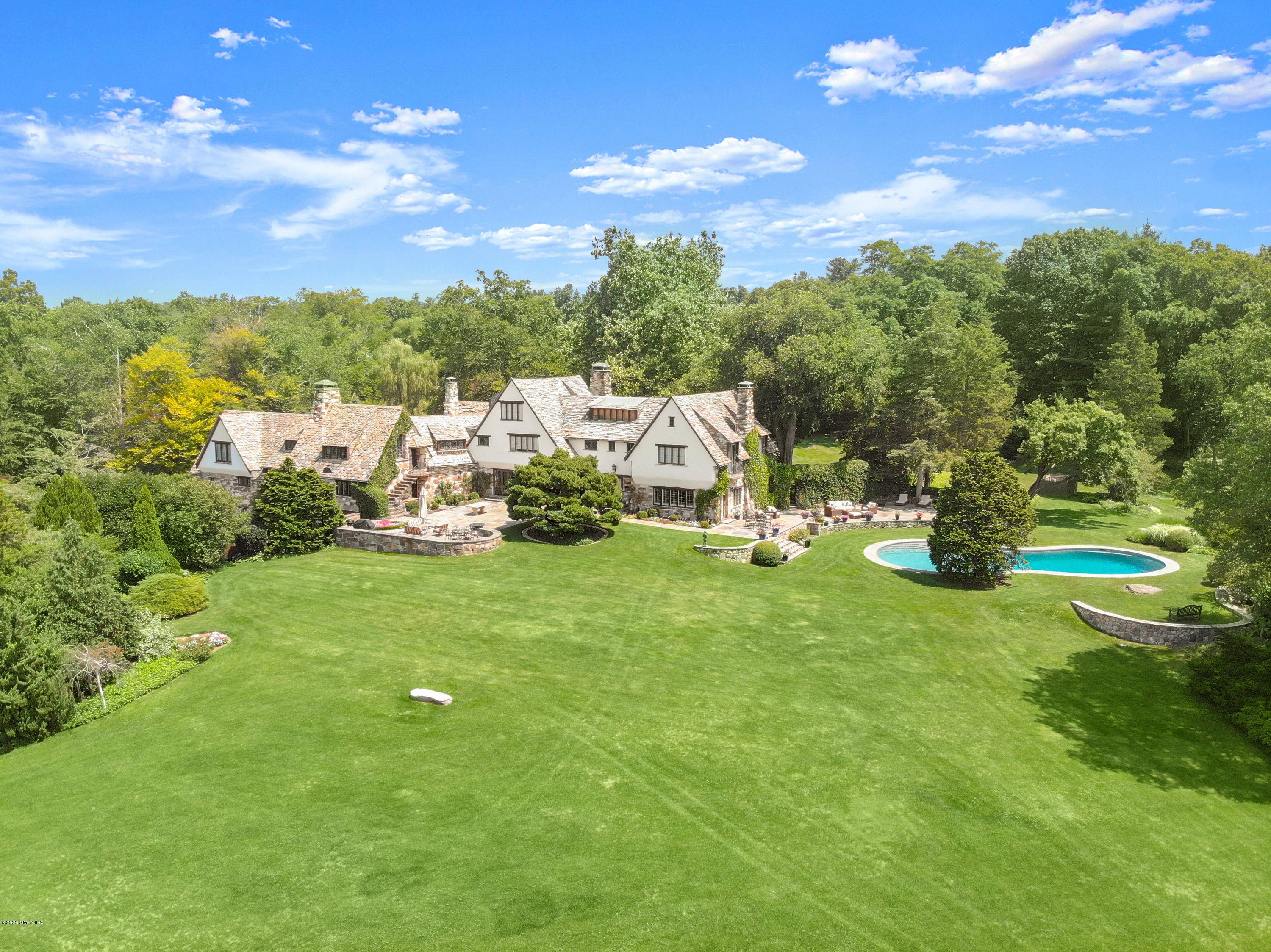 Spectacular 8. 3 acre Round Hill estate approached by a private gated windy drive, 30 Round Hill offers a peaceful mid country retreat with authentic six bedroom English Manor, pool, ...