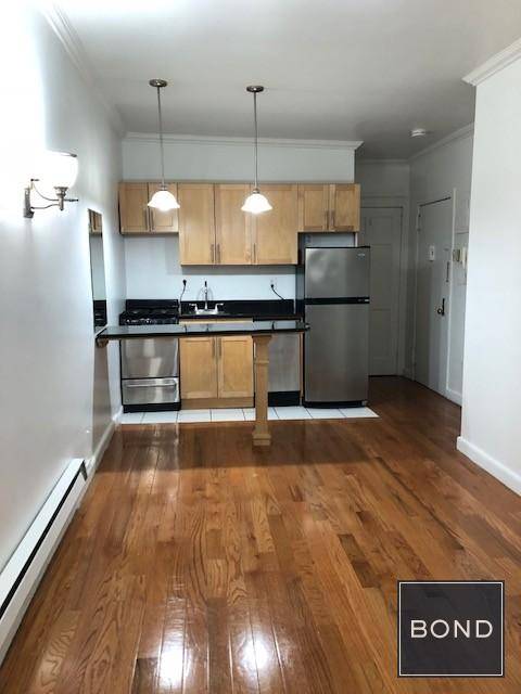 Only two flights up, this clean and renovated unit features French doors, a breakfast island, stainless steel appliances, and dishwasher.
