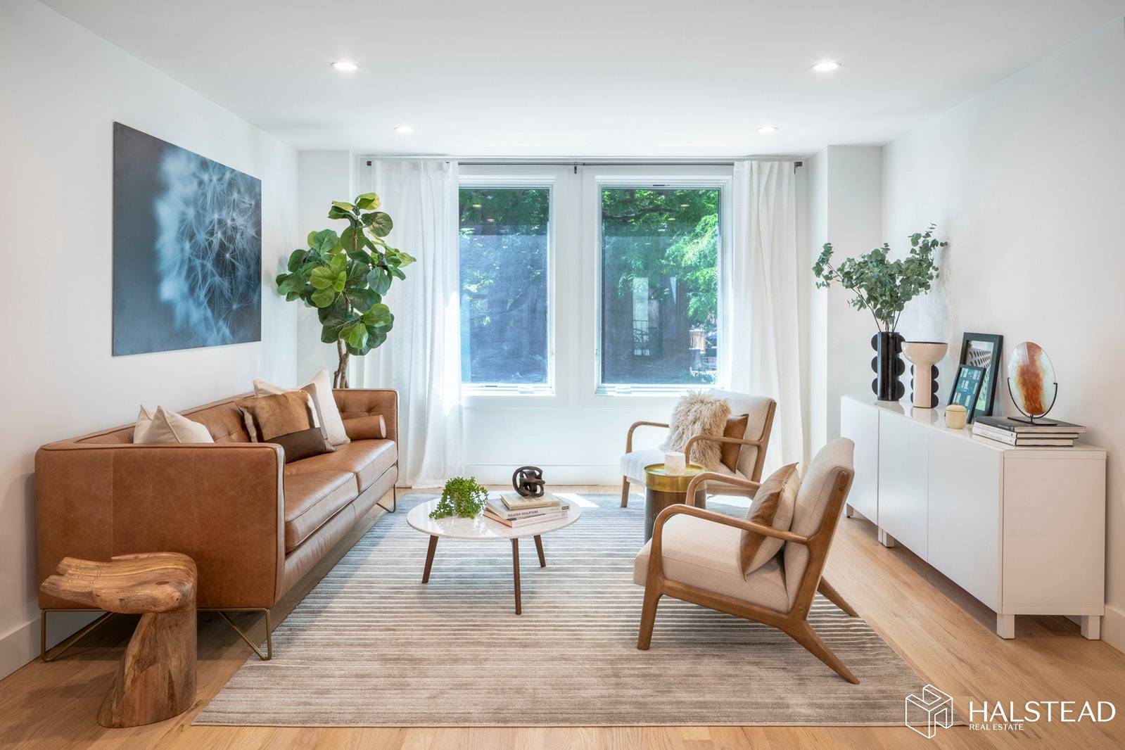 This spacious floor through residence features both east and west exposures creating a bright and airy space in every room throughout the home.