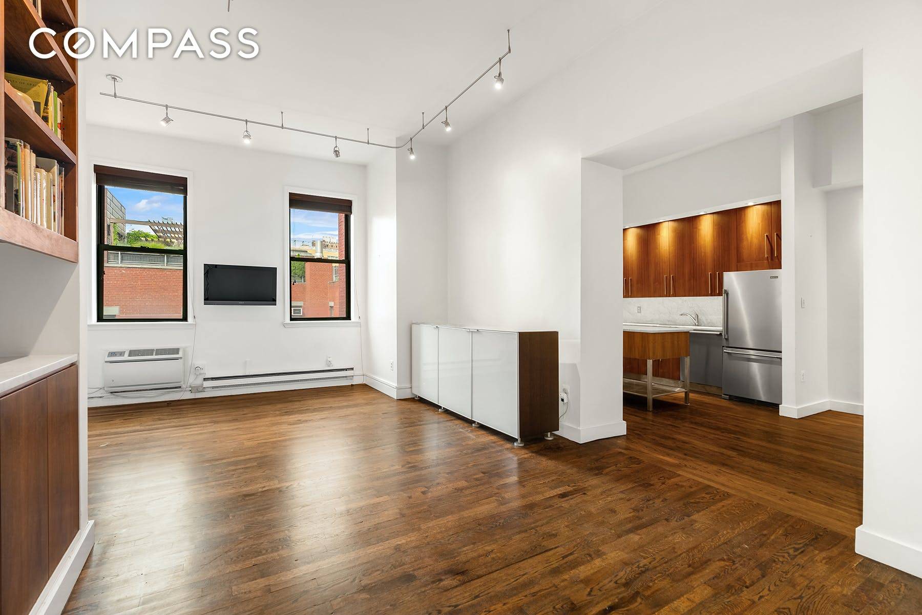 Expansive, fully renovated loft style one bedroom with two full baths on storied Waverly Place.