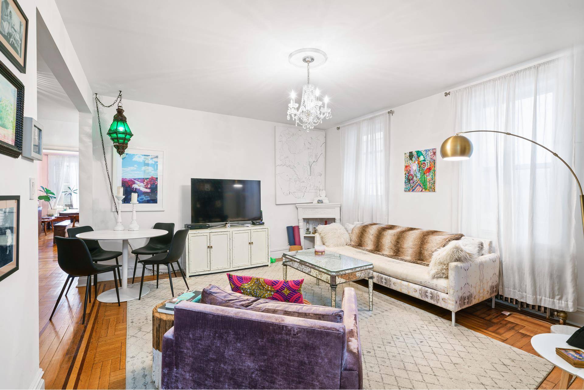 Airy two bedrooms with blend of traditional prewar details mixed with art mode.