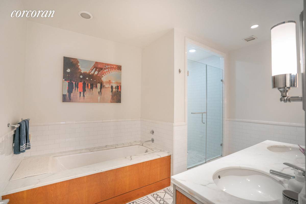 Welcome to this gorgeous two bed, two and a half bath unit in a historic white glove Downtown building.