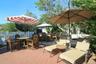 View of patio featuring outdoor dining area and a gazebo