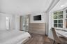 PRIMARY BEDROOM: .. YES! in case you were wondering .. Private French doors open up to the calming spaces aka Sunroom.