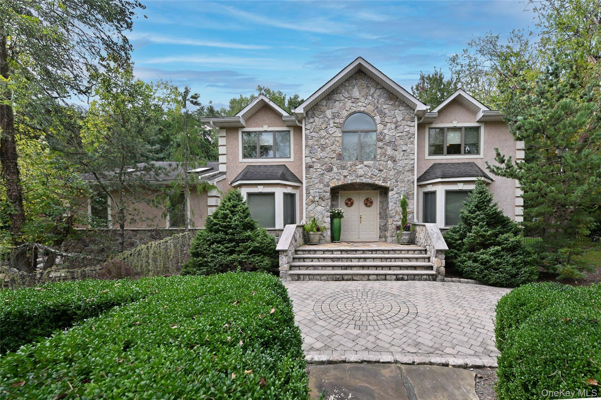 Welcome to this Stunning Colonial, blending luxury and exceptional amenities with natural beauty.