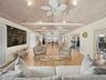The great room is open to the large dining area leading to the spacious kitchen with island.