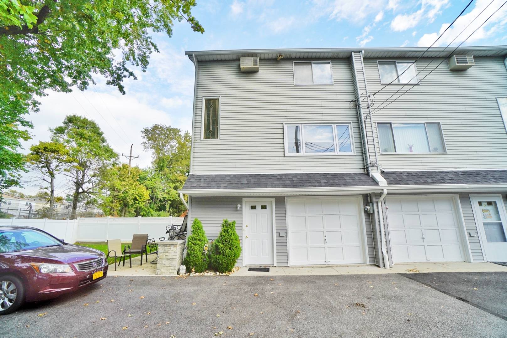 Rare Find. Beautiful end unit townhouse with huge private yard and 2 car garage.