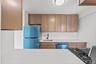 New cabinetry featuring neutral quartz counter tops