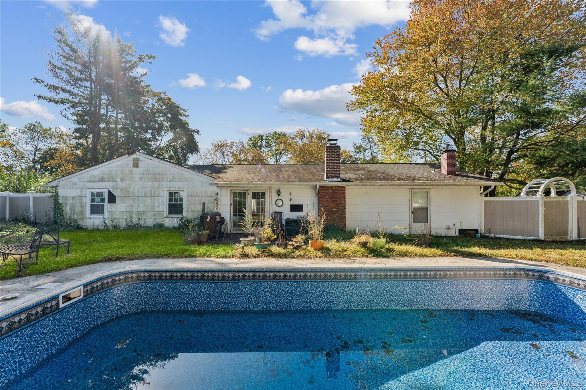 Full of possibility and charm, this Stony Brook ranch features 4 bedrooms, 2 baths, and a newly lined pool perfect for warm weather entertaining.