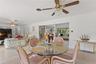 View of family room and informal eating area with view into formal areas.
