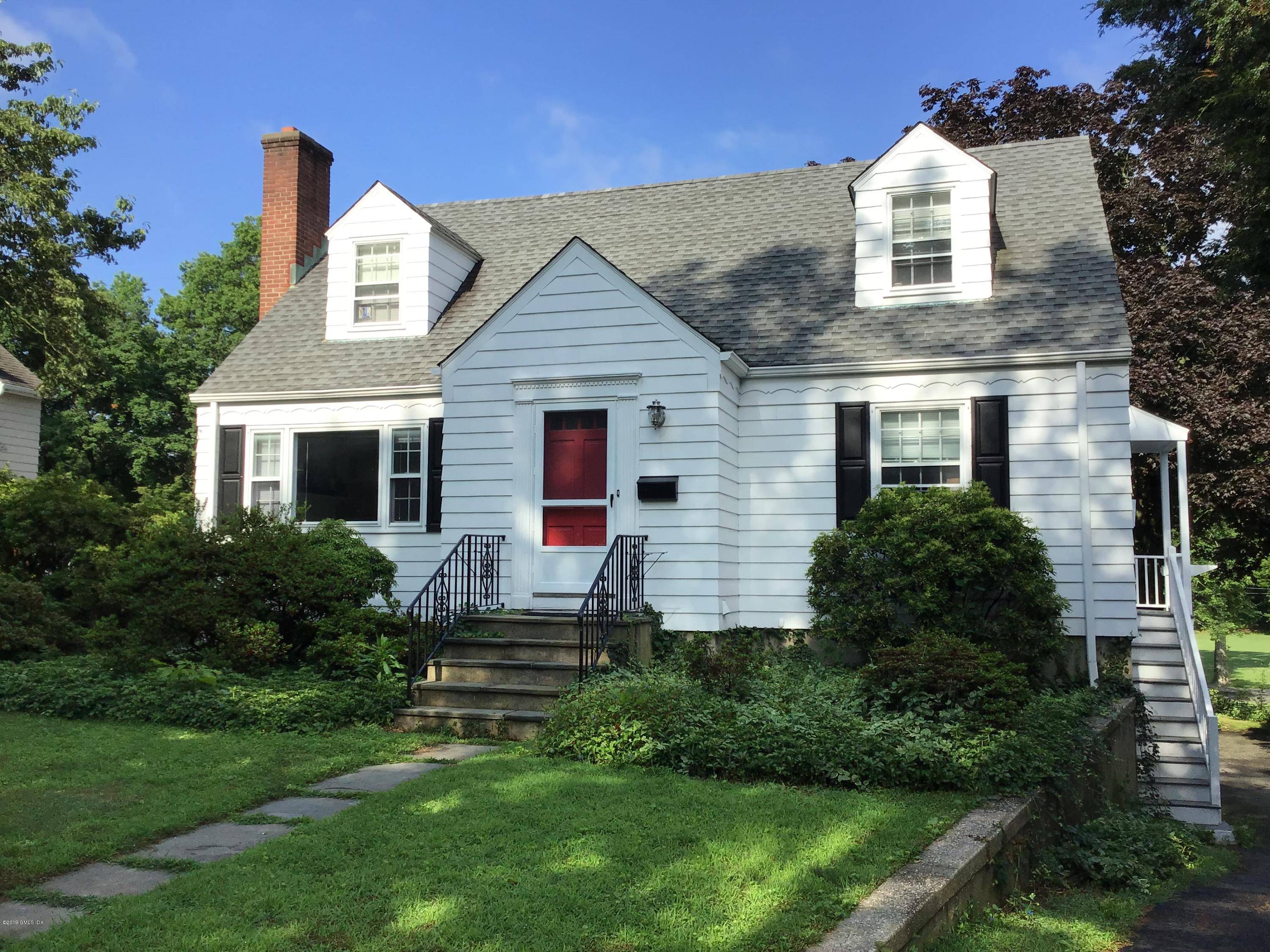 A sunny classic colonial with charming details in an ideal location the heart of Cos Cob.