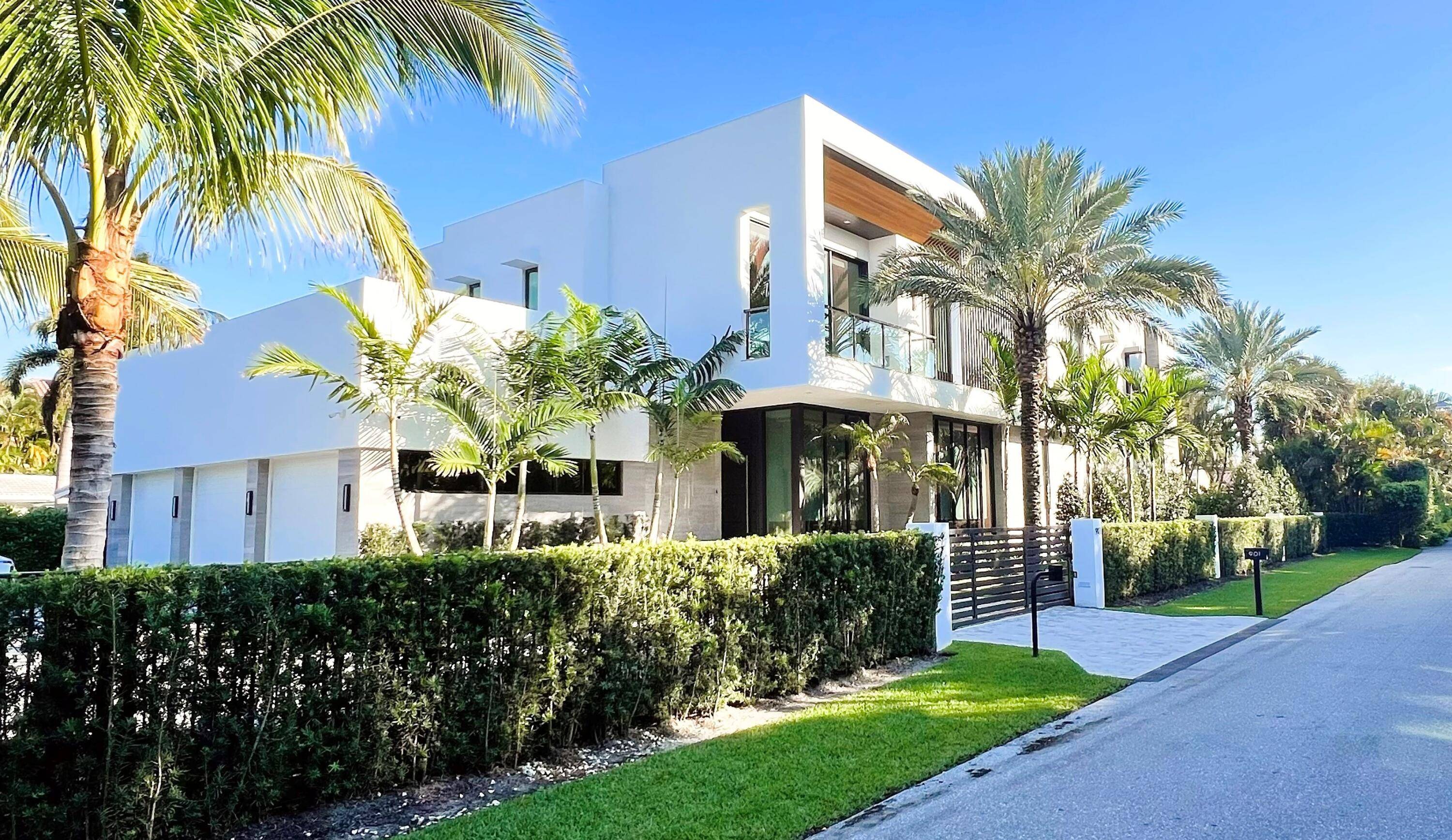 Exquisite Delray Beach Private Gate Guarded Contemporary Waterfront Estate Perfectly Set On A Secluded Canal With Picturesque Intracoastal Views.