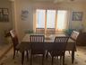 Dining space featuring light tile patterned floors, ornamental molding, and ceiling fan