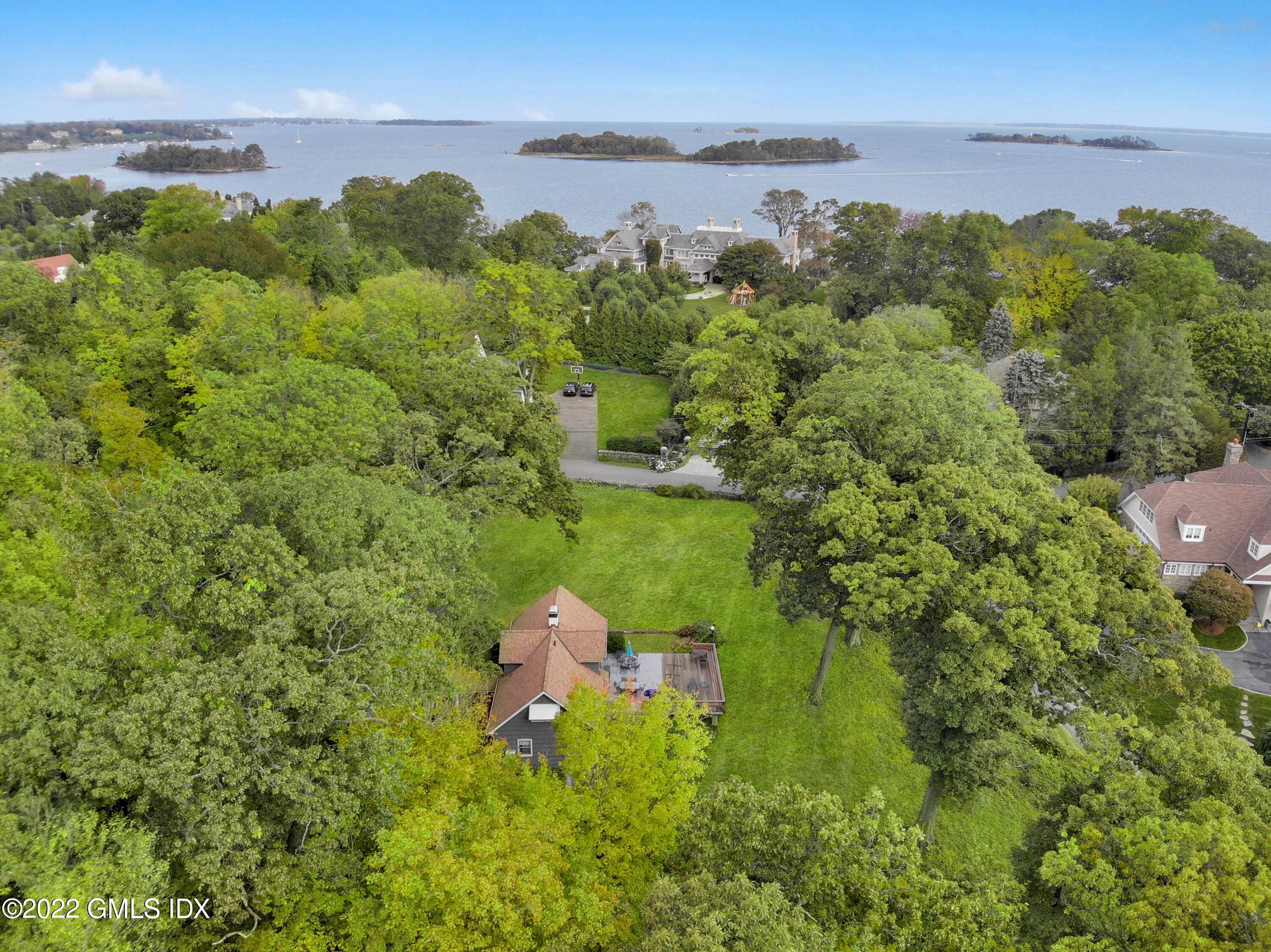 Water view building lot located in the private section of Byram Shore Road with deeded access to private Hawthorne Beach Association, which has magnificent waterfront homes.