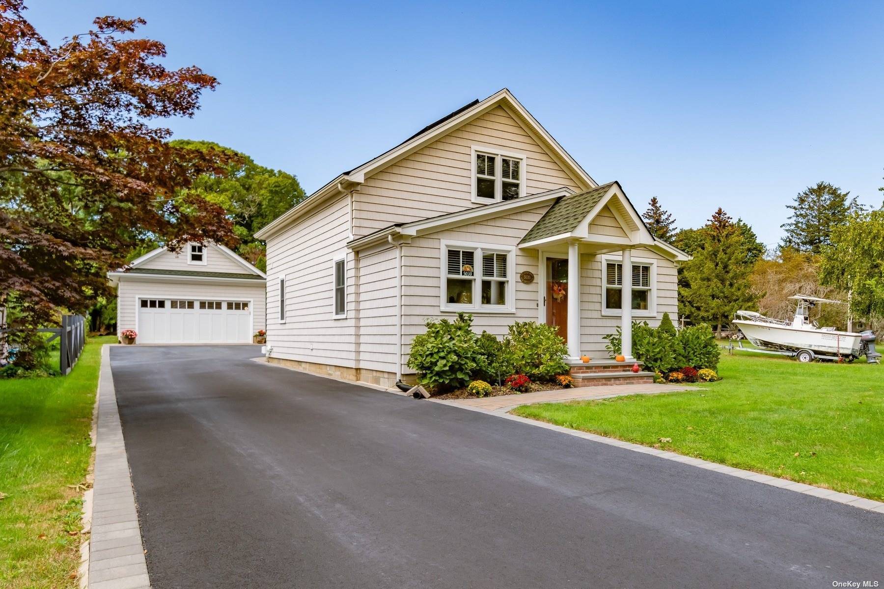 A Simply Perfect and Entirely Turn Key Cottage Style Home in Coveted New Suffolk, NY.