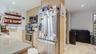 Kitchen featuring stainless steel appliances, light brown cabinets, recessed lighting, decorative backsplash, and open shelves