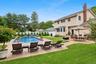 View of swimming pool featuring a patio area, a fenced backyard, and area for grilling