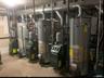 Utilities featuring water heater and a heating unit