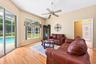 Both spaces enjoy sliding glass doors to the SCREENED LANAI, allowing NATURAL LIGHT to pour inside while making it easy to move the party outdoors.