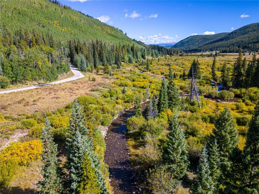 Spectacular custom homesite with the Blue River running through it.