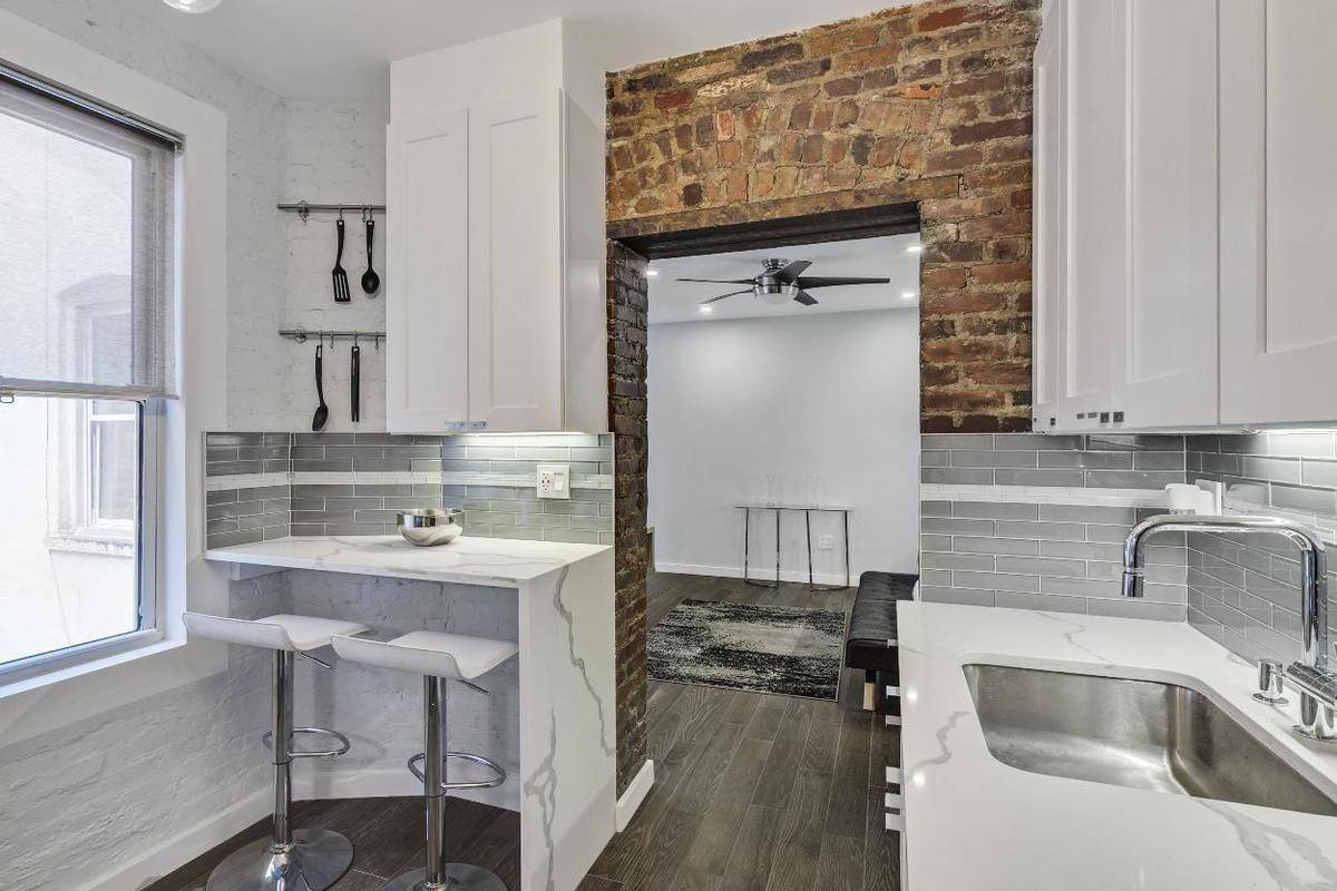 Nestled in the heart of the East Village, this beautifully gut renovated two bedroom, one bath residence is loaded with character, charm, and sunlight !