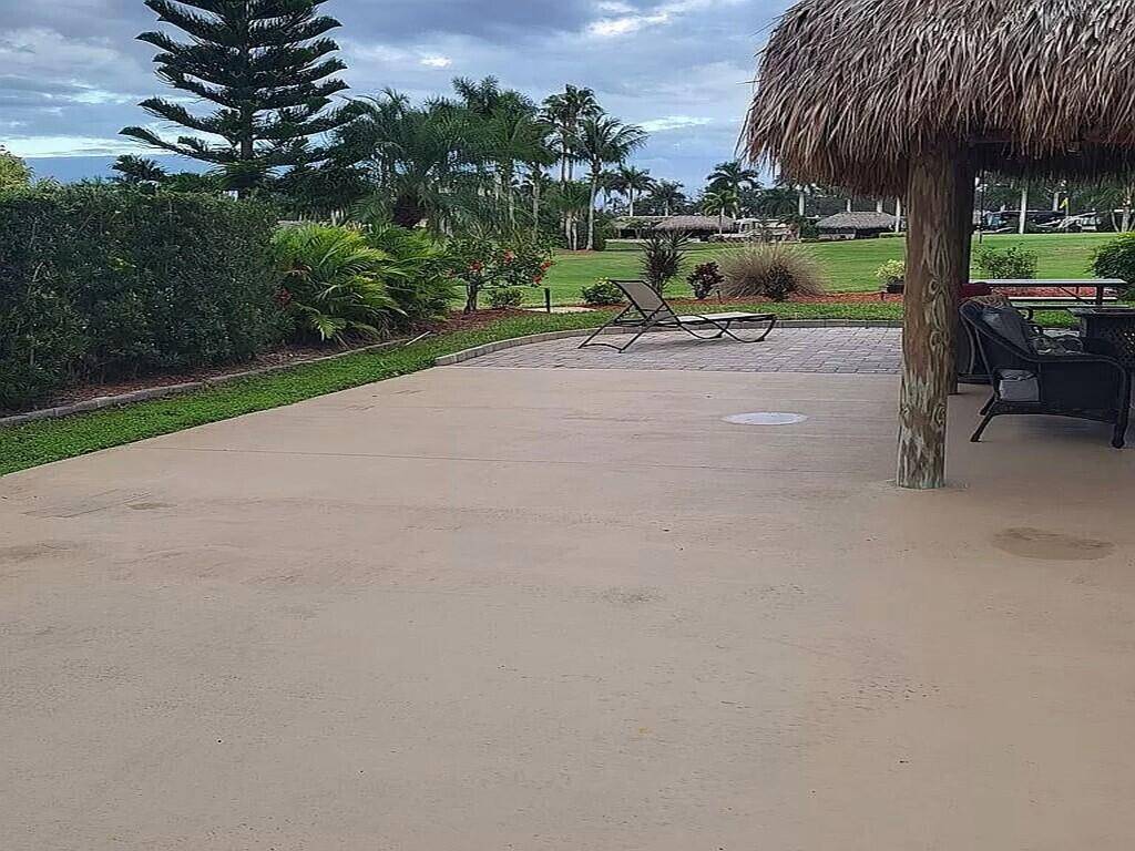 Golf course view lot with newer tiki located at Motorcoach Resort in St.