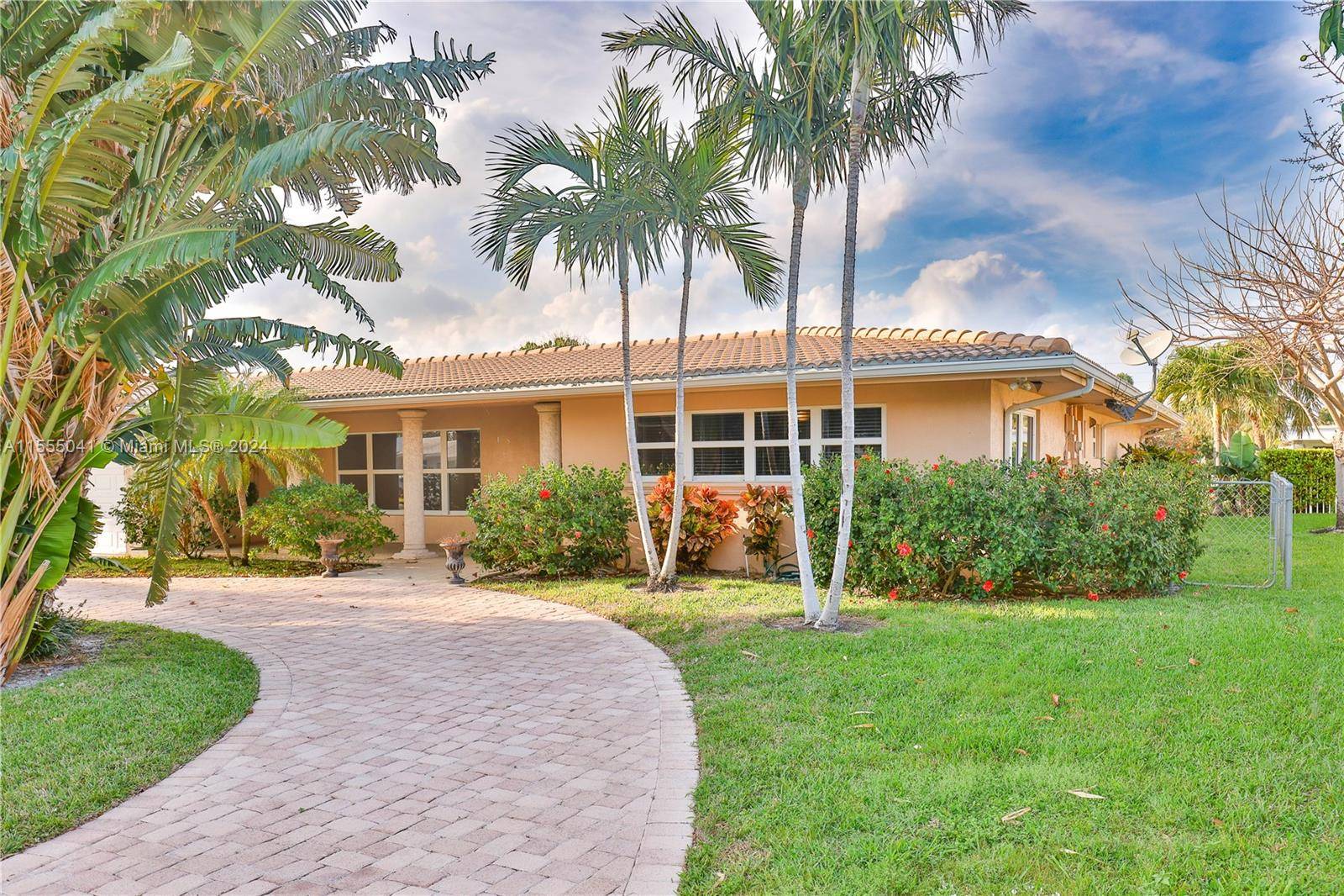Water front over sized heated pool home with huge backyard in beautiful Lighthouse Point.